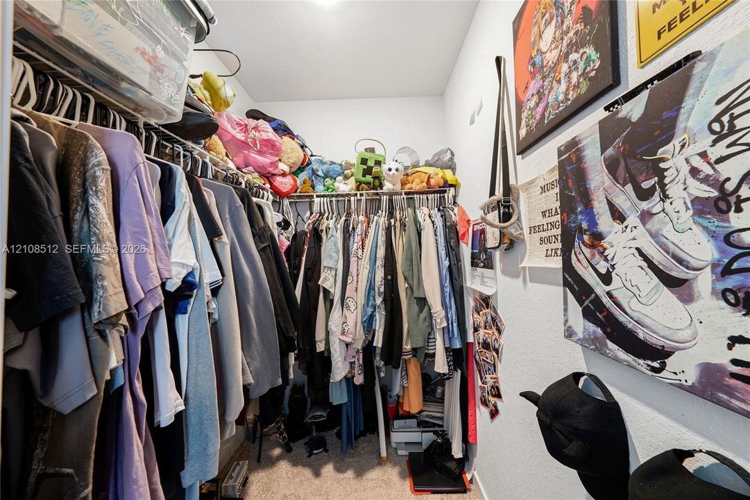 Reach-in closet featuring wire shelving