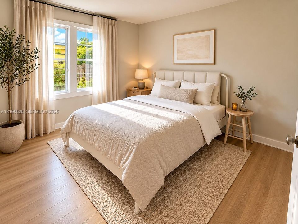 Bedroom featuring wood-finish flooring, neutral wall tones, and a dual-pane window