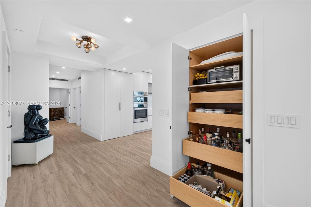 Additional wood pull outs in hallway pantry space