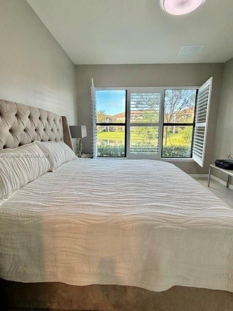 Triple-pane window configuration featuring white plantation shutters and natural lighting