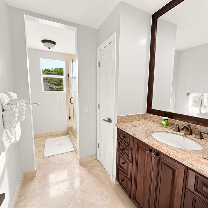 Bathroom with vanity and walk in shower