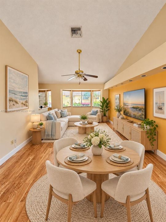 Vaulted ceilings, wood-finish flooring, recessed lighting, and a bay window