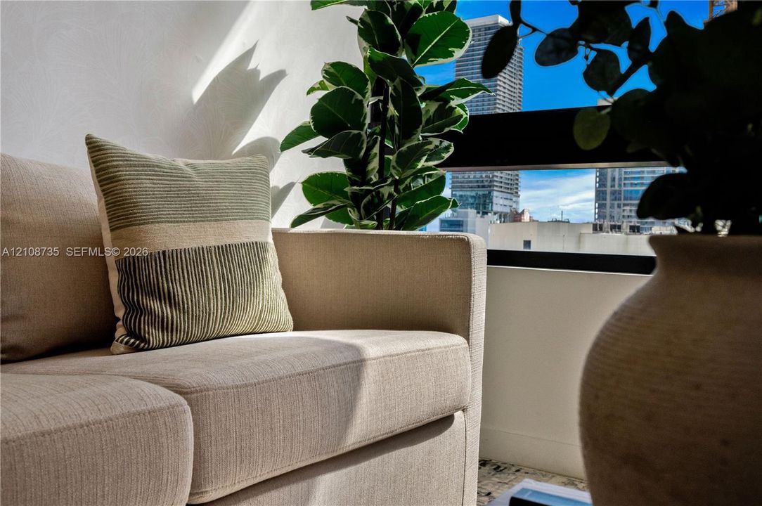 Horizontal window featuring a black frame and urban city skyline backdrop