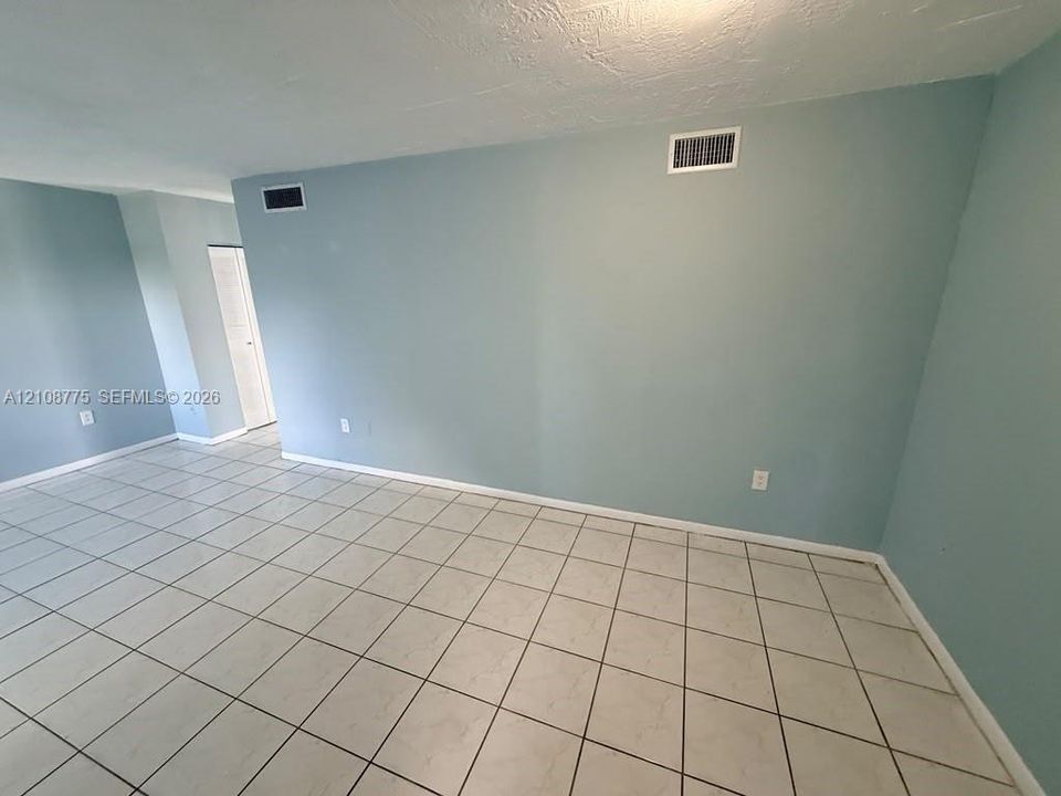 Neutral wall paint and large-format tile flooring