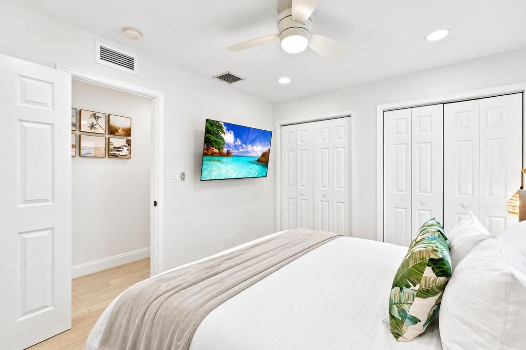 Bright Coastal Bedroom with Tropical Vie
