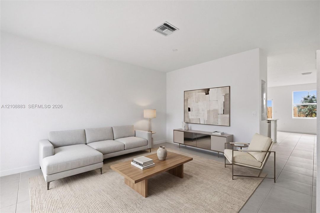 Neutral-toned interior space featuring light-colored tile flooring and high ceilings