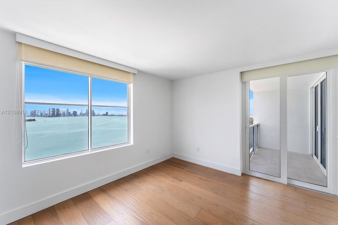 Bedroom 2 featuring access to main balcony and unprecedented bayviews.