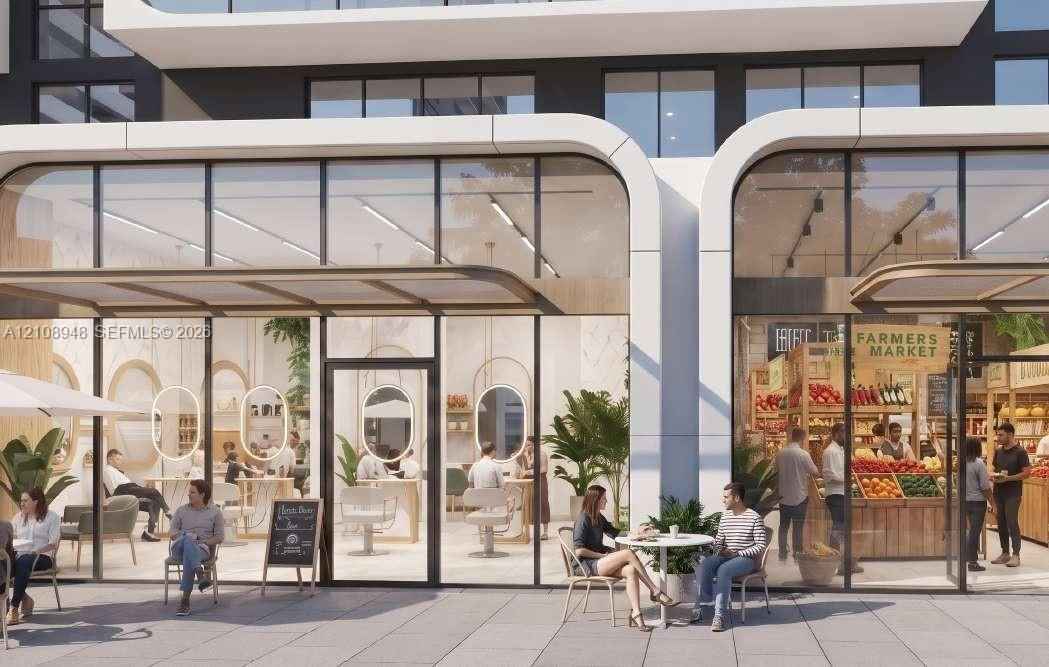 Ground-level commercial storefronts featuring expansive floor-to-ceiling glass paneling, modern white architectural framing, and integrated recessed ceiling lighting