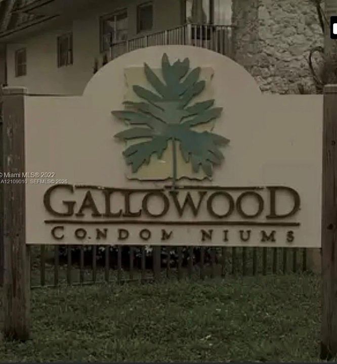 Freestanding Gallowood Condominiums monument sign featuring dimensional metal lettering and a decorative palm leaf emblem