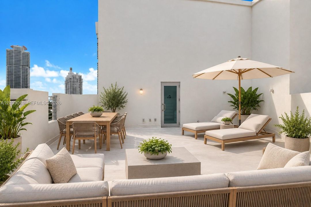 Rooftop terrace featuring light-toned stone tile flooring, perimeter privacy walls, and a single-light glass door