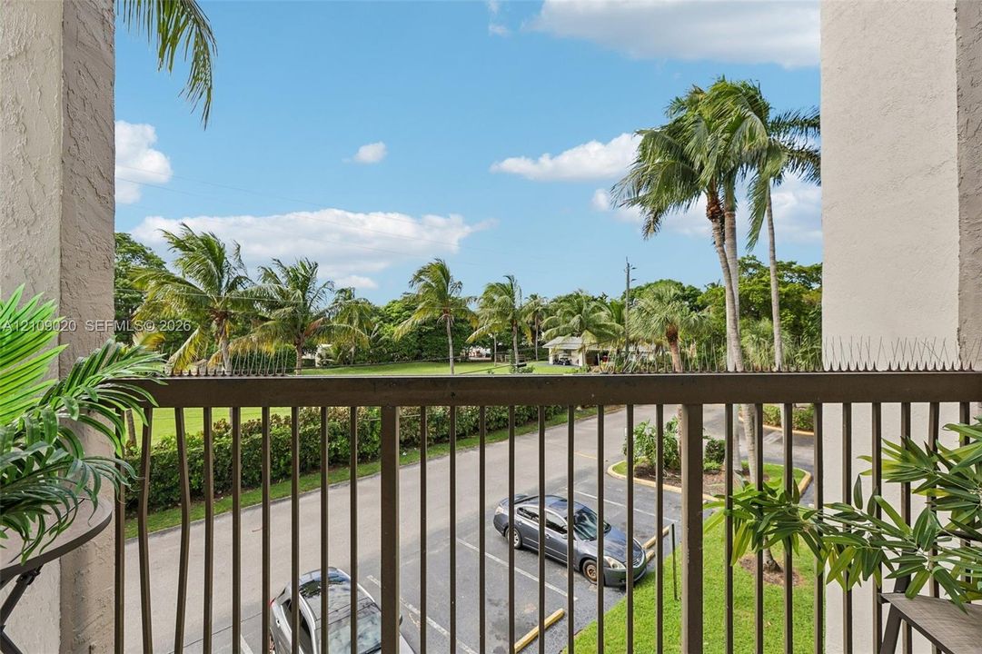 Private balcony featuring vertical metal railing