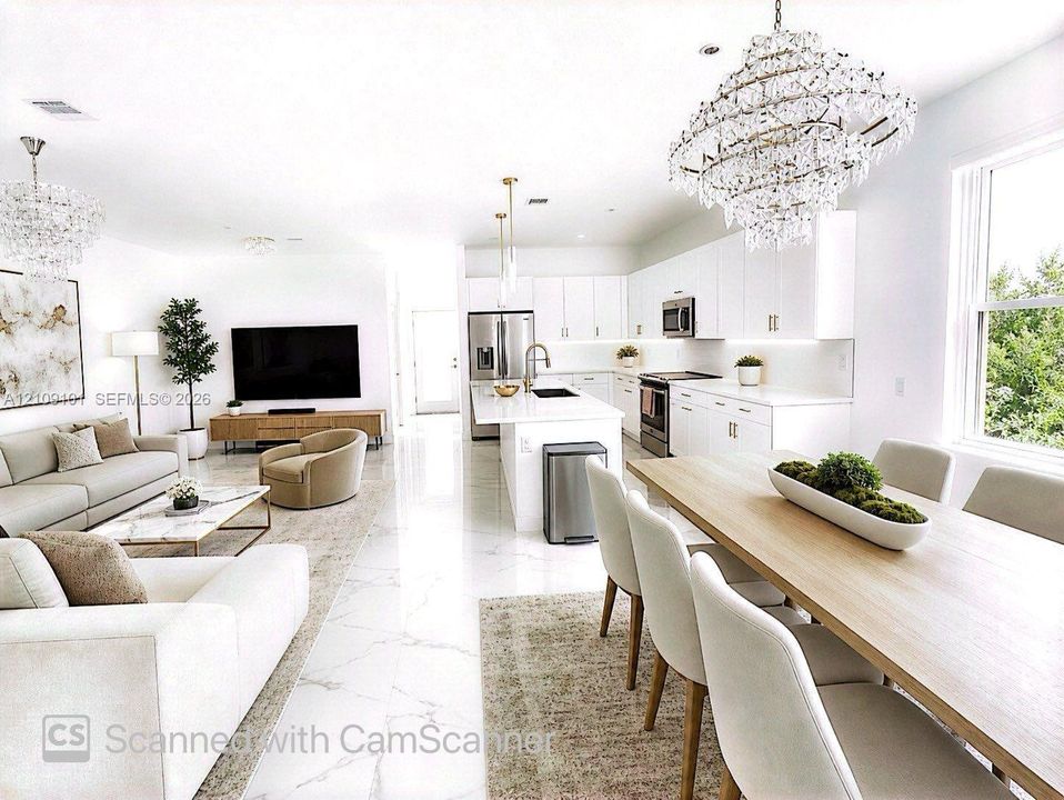 Open-concept living space featuring high-gloss large-format floor tile, white cabinetry with integrated under-cabinet lighting, a central kitchen island with a quartz countertop, and oversized crystal-style chandelier lighting fixtures