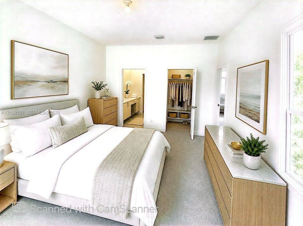 Bedroom featuring neutral carpeting, double-door closet, and dual entryways to interior spaces