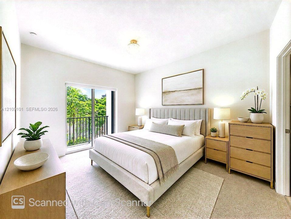 Neutral-toned carpeted flooring, flush-mount ceiling lighting, and a sliding glass door providing external access to a metal-railed balcony