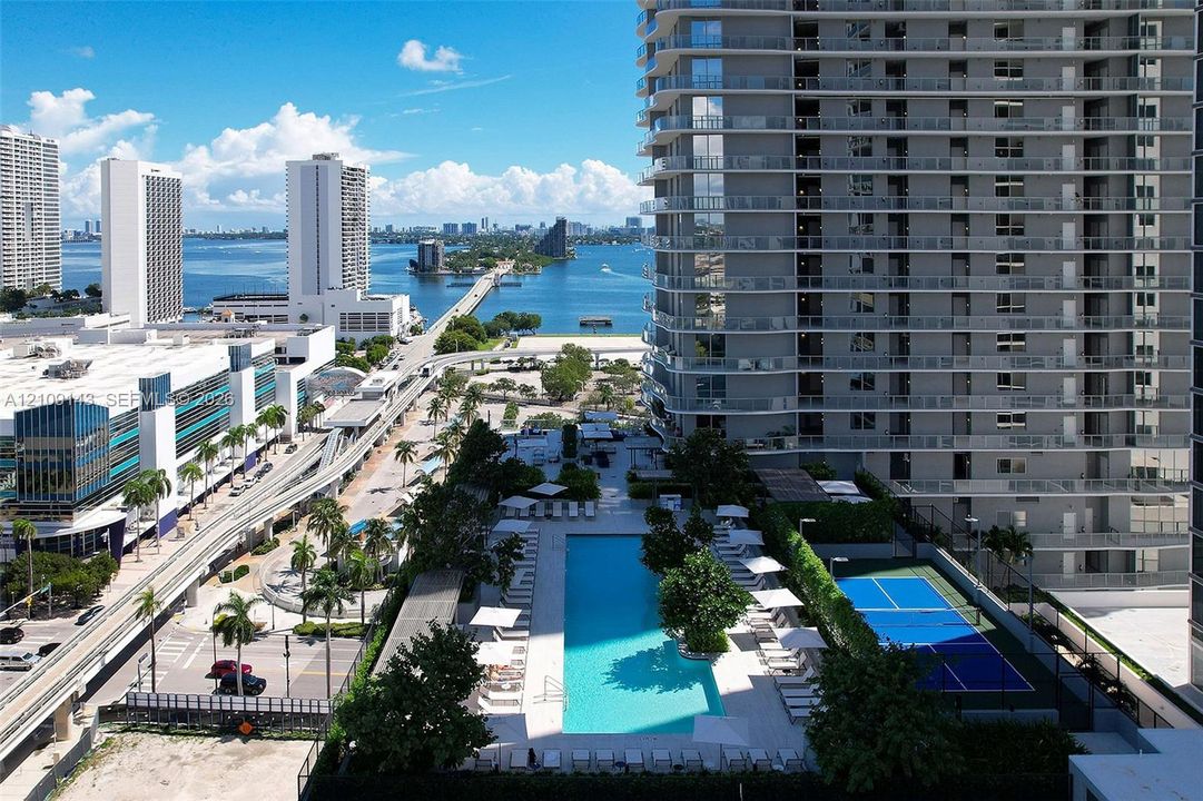 Casa Bella Tower showing the view from the west side, including the pools and pickleball court