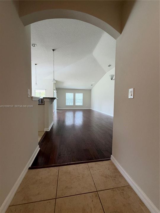 Expansive grounds featuring a waterfront lot, mature trees, and established landscaping