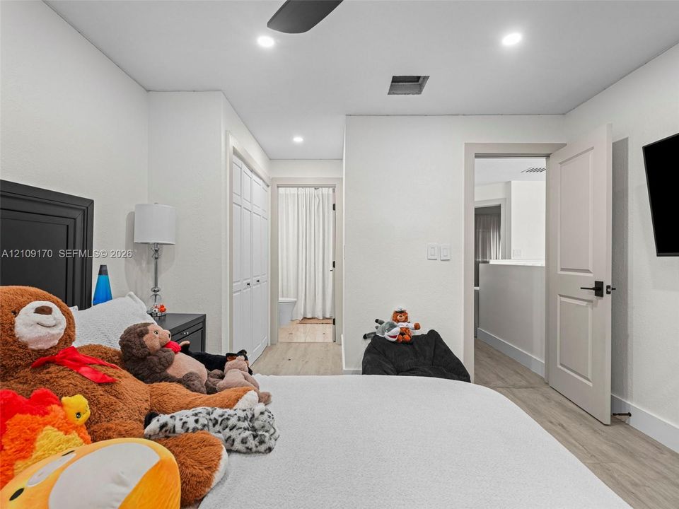Neutral interior featuring light-tone wood-finish flooring, recessed lighting, and a neutral color palette