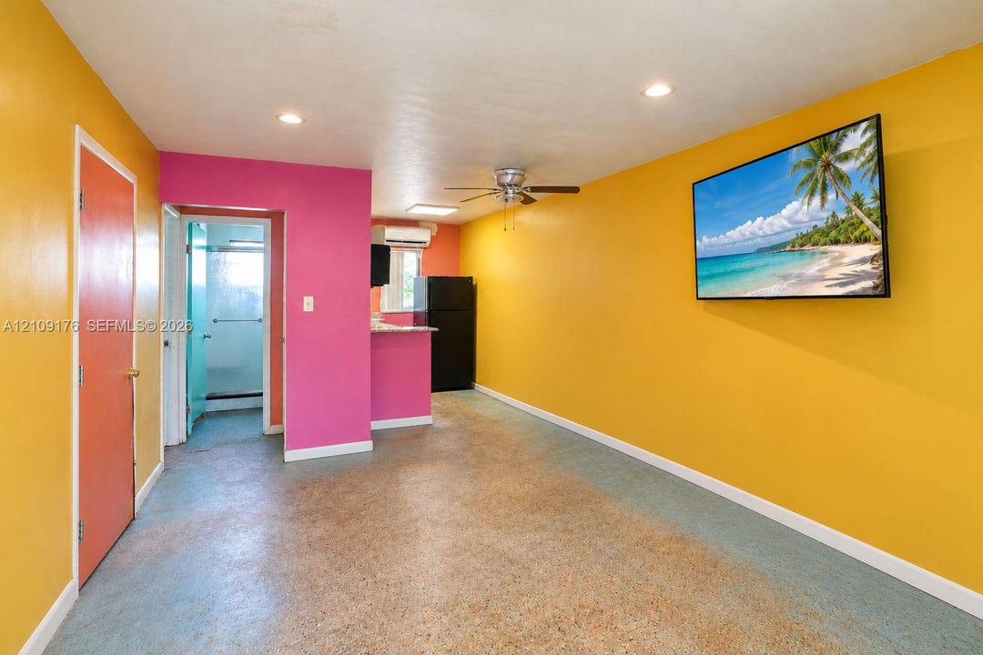 Interior space featuring recessed lighting, a ceiling fan, and concrete flooring