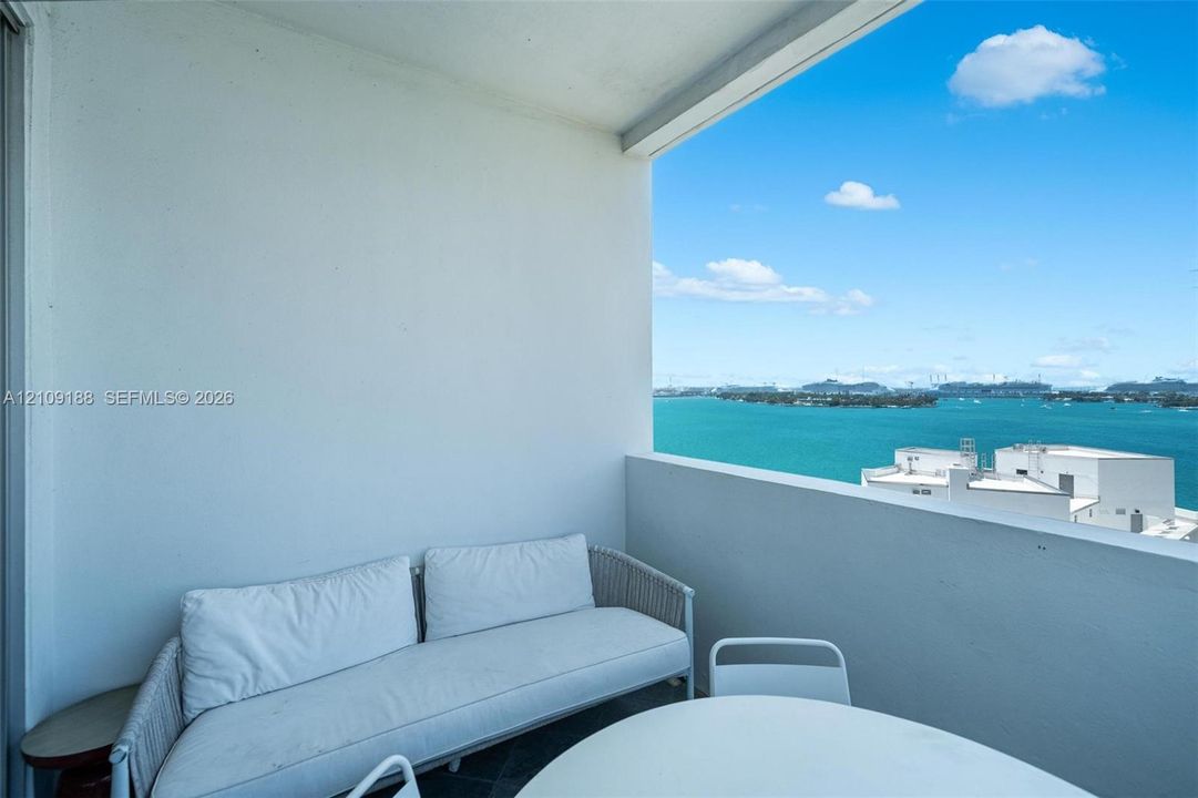 Spacious balcony with bay, skyline and cruise ship views