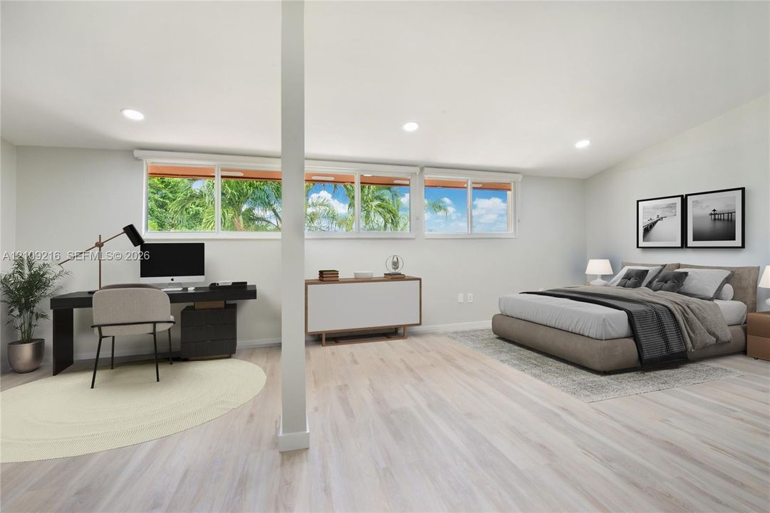 Light-filled room featuring wood-finish flooring, recessed lighting, and horizontal windows with exterior greenery