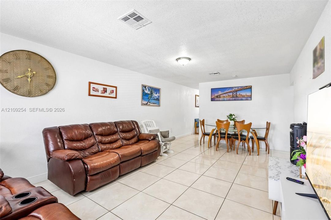 Large-format tile flooring and neutral wall color palette