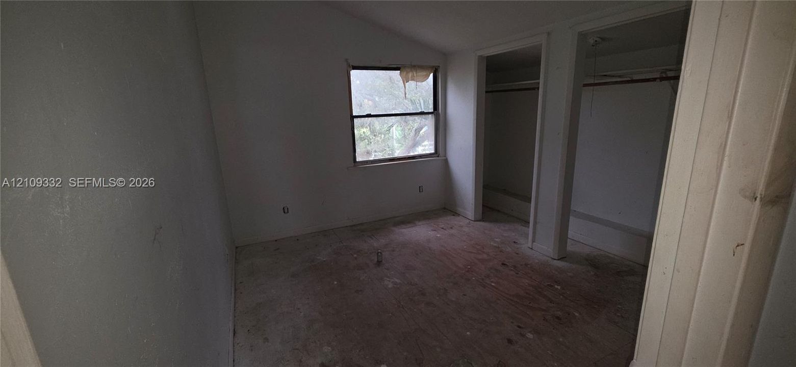 Vaulted ceiling, natural lighting, and dual reach-in closet spaces