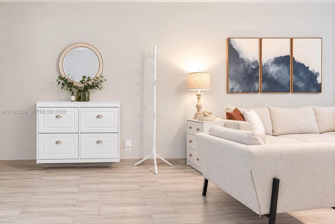 Wood-finish flooring and wall-mounted white cabinetry