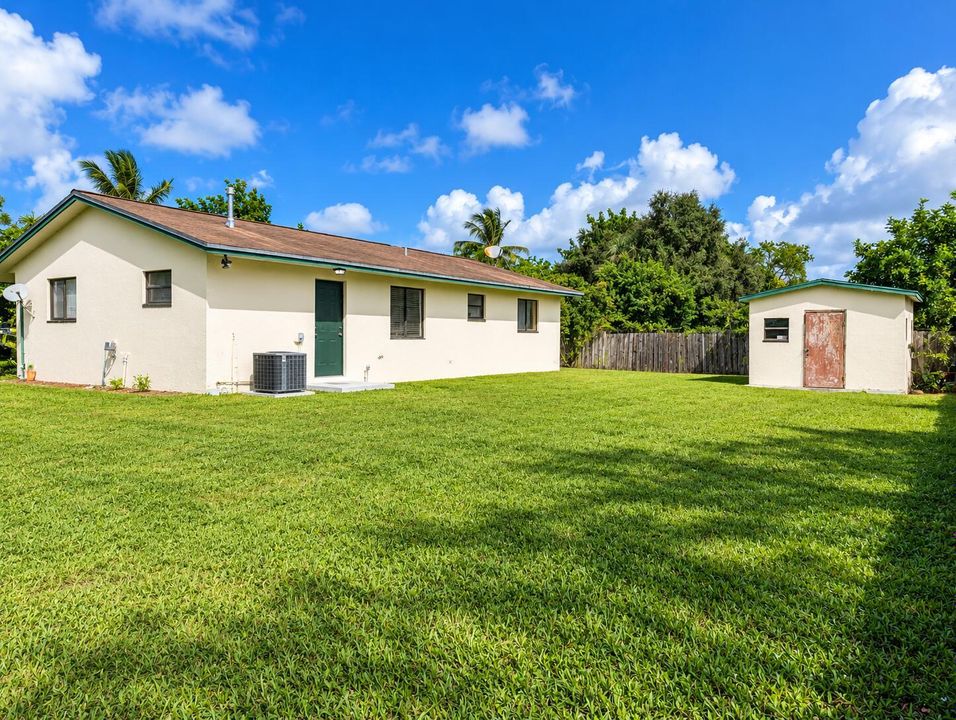 Sunny Tropical Backyard Bungalow and She