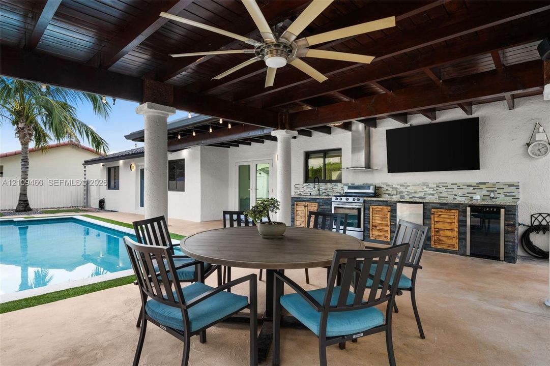 Covered pavilion with dining and outdoor kitchen
