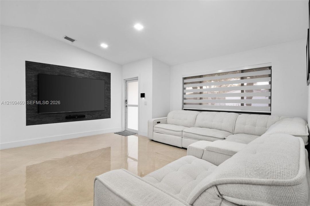 Living area with stone-clad media wall