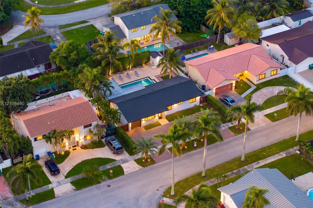Aerial view of the home at dusk