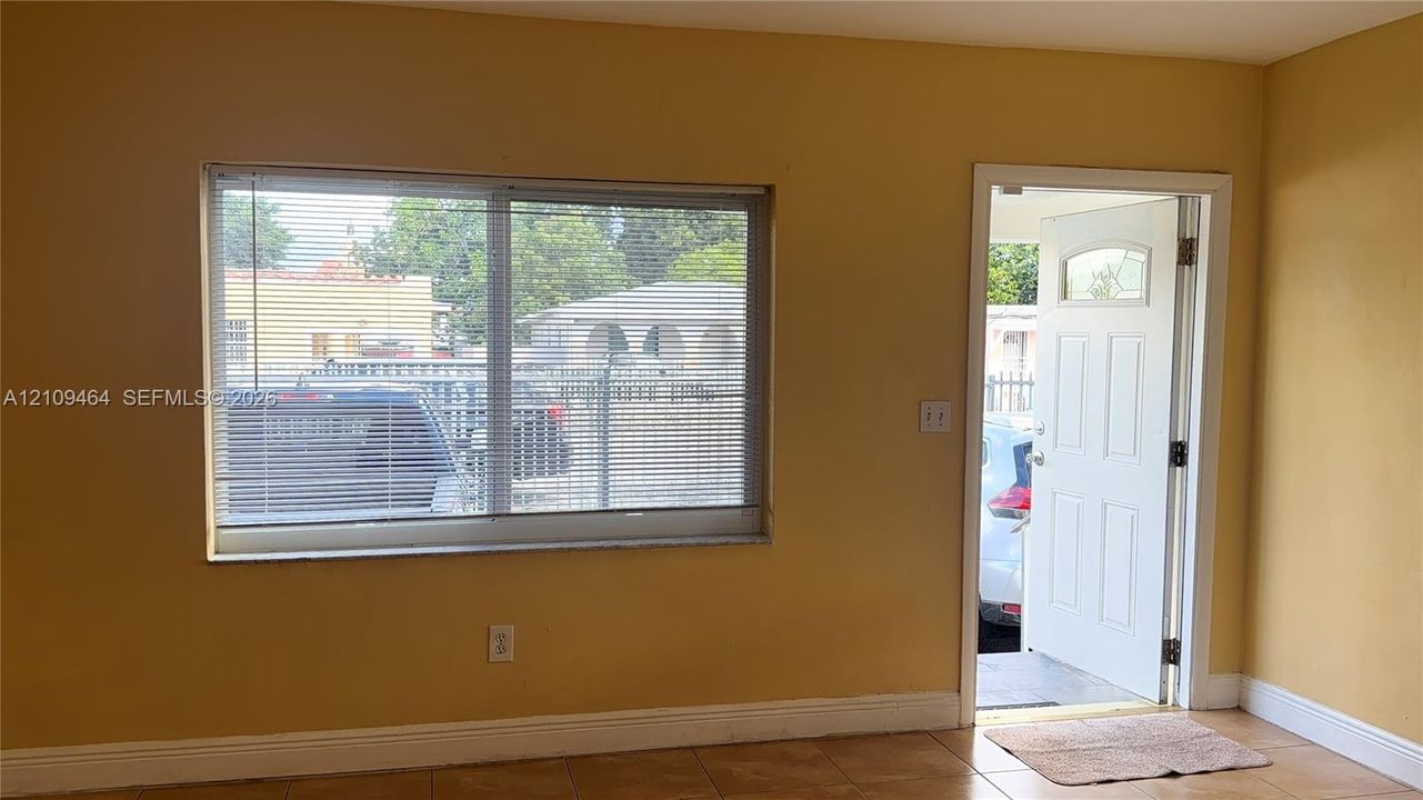 Large dual-pane sliding window, exterior door