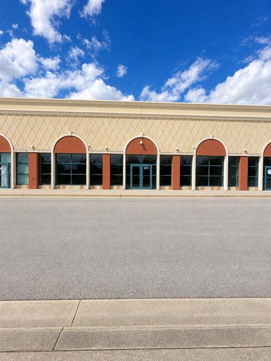 Symmetrical Strip Mall Façade with Arch