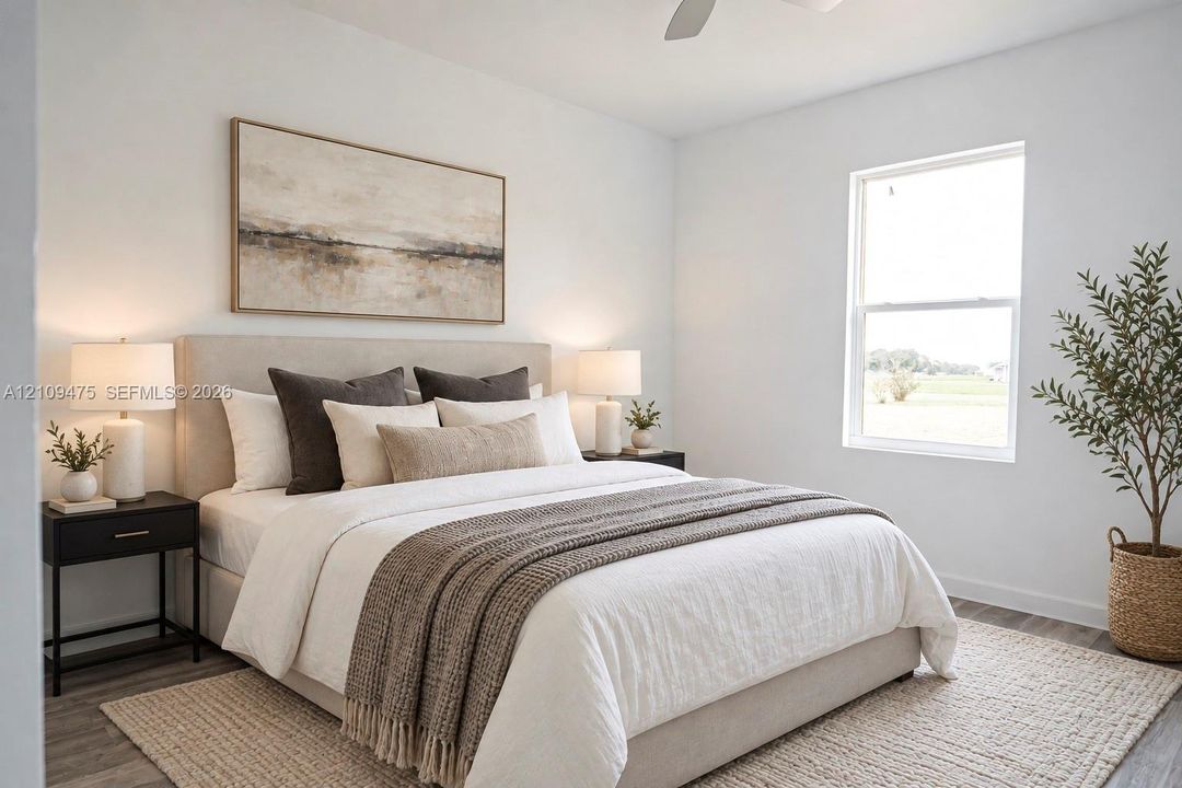 Neutral-toned interior featuring wood-finish flooring, a single-hung window, and a ceiling fan
