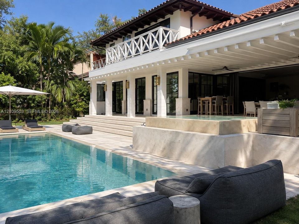 Exterior terrace featuring a swimming pool, integrated spa, covered patio with recessed lighting, and a second-level balcony with white lattice railing