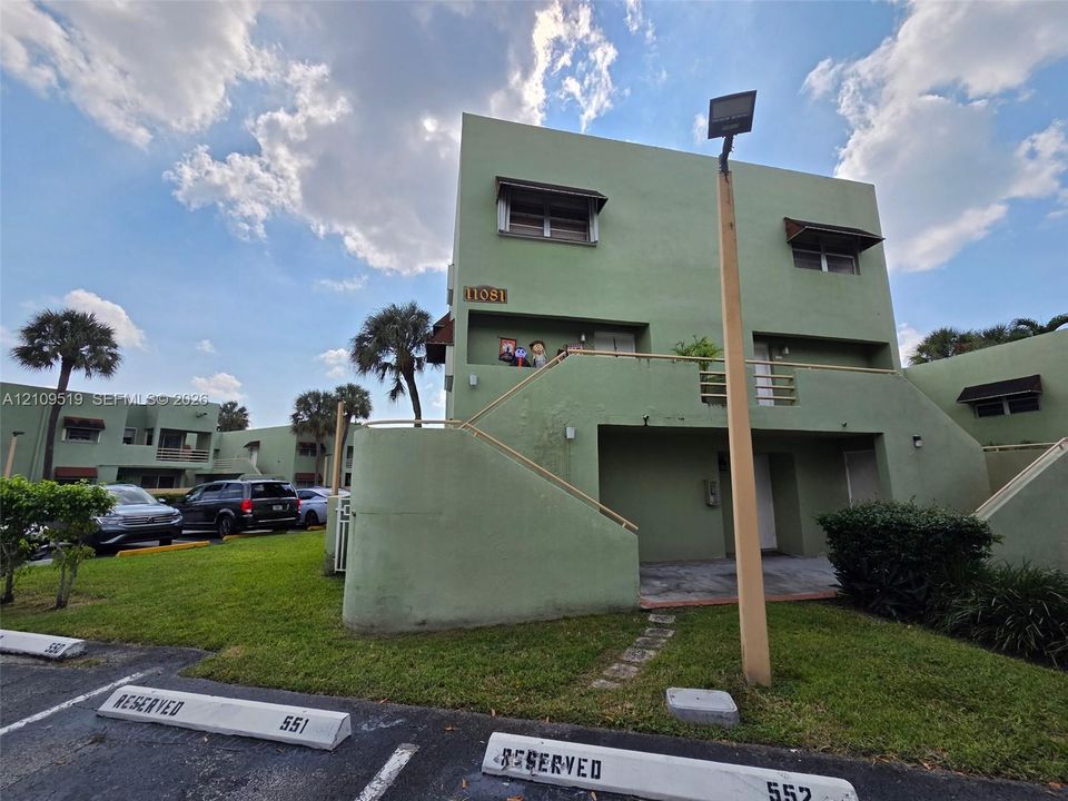 Ground-level corner unit encompasses entire first floor of structure. Features deeded parking in front of your unit plus guest parking spaces. Convenient easy access thru both private terraces into primary bedroom and living room.