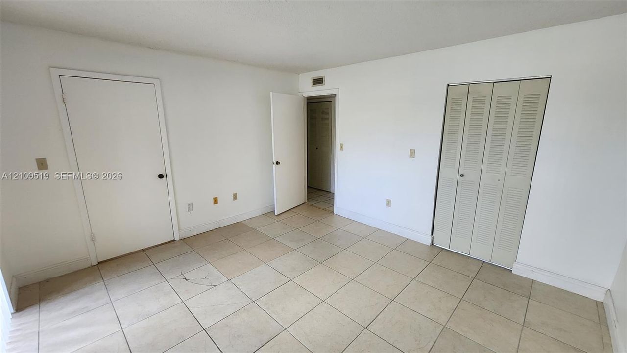 Walk-in closet in Primary bedroom suite is  generously sized offering lots of storage.