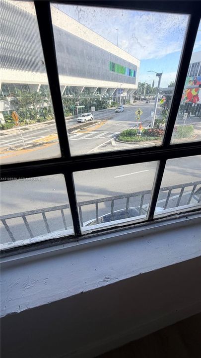 Multi-pane window with a black frame and a fixed horizontal sill