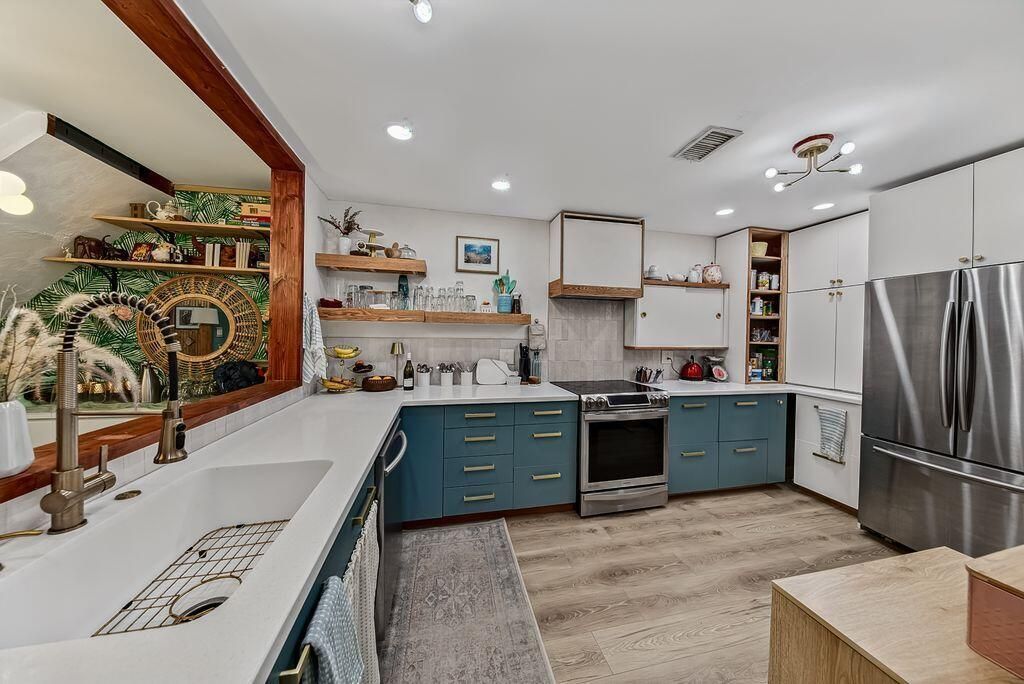 Kitchen with opening to Living room