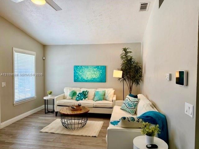 Vaulted ceiling with a ceiling fan