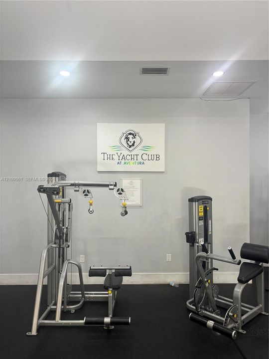 Fitness center featuring rubberized flooring and recessed ceiling lighting