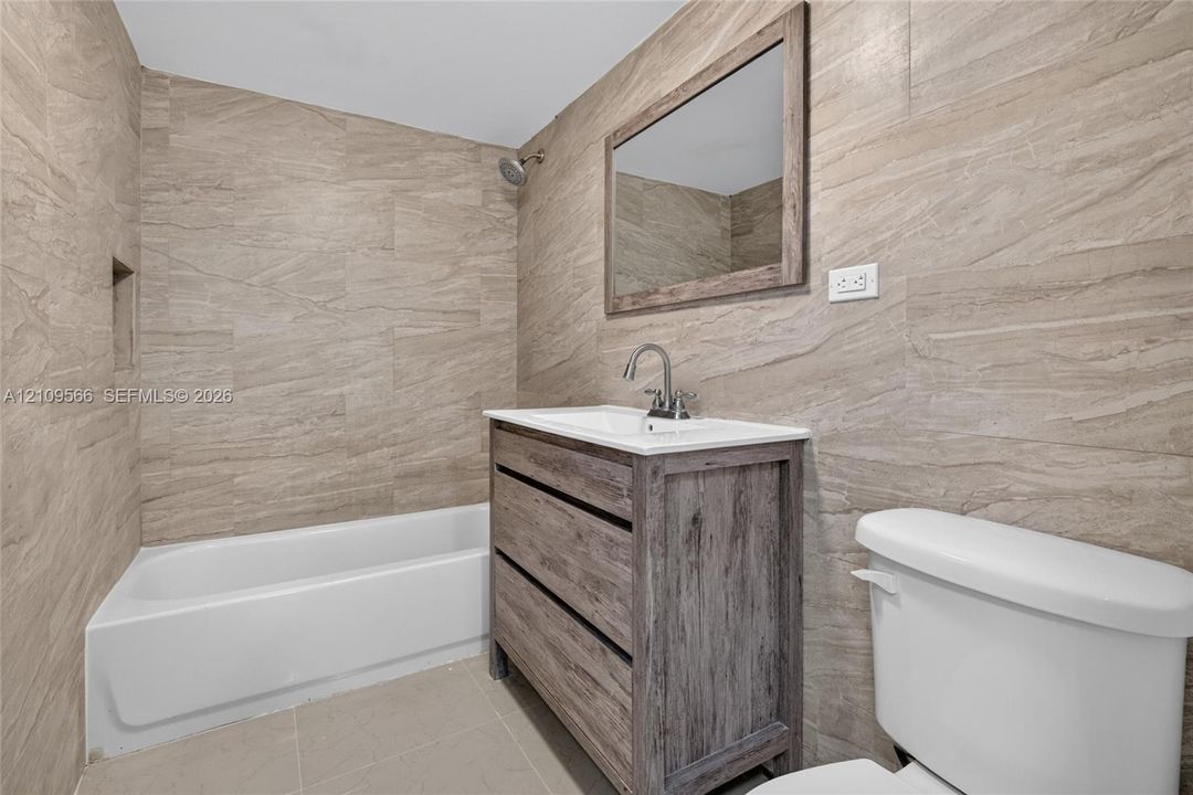 Second bathroom with tub and shower
