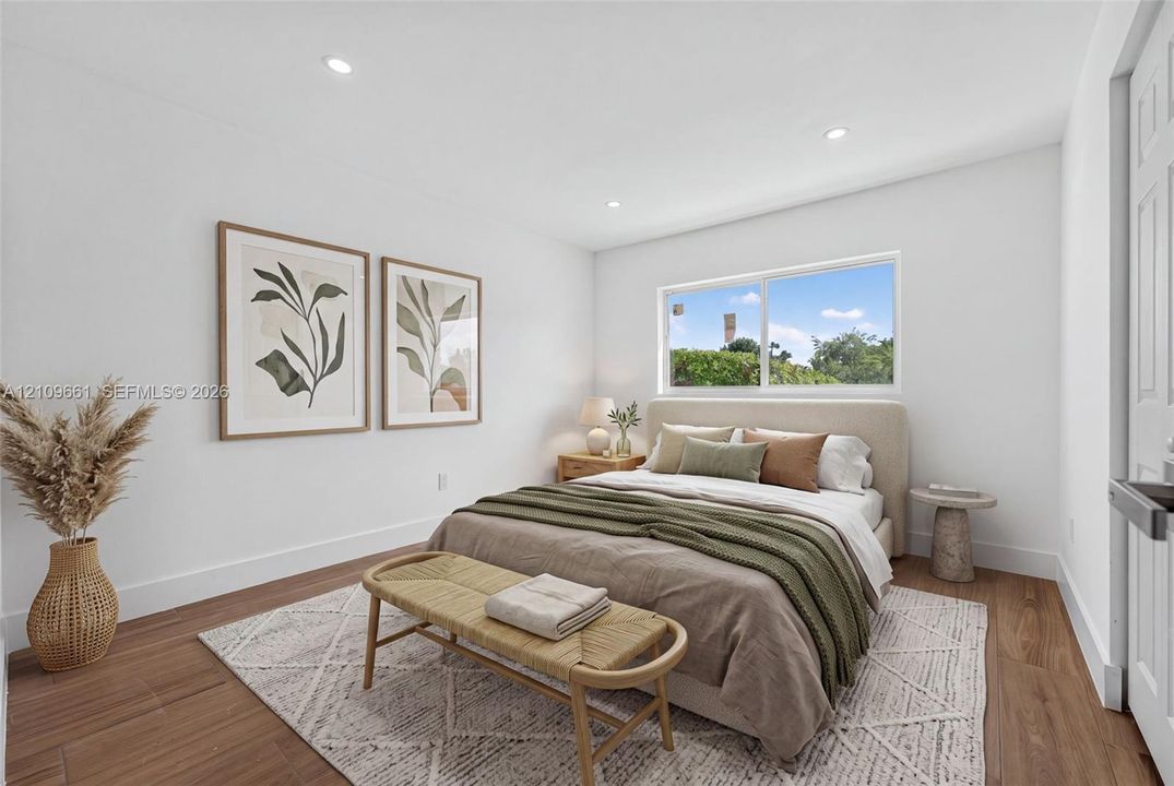 (AI-staged) Room featuring wood-finish flooring, recessed lighting, and a horizontal sliding window