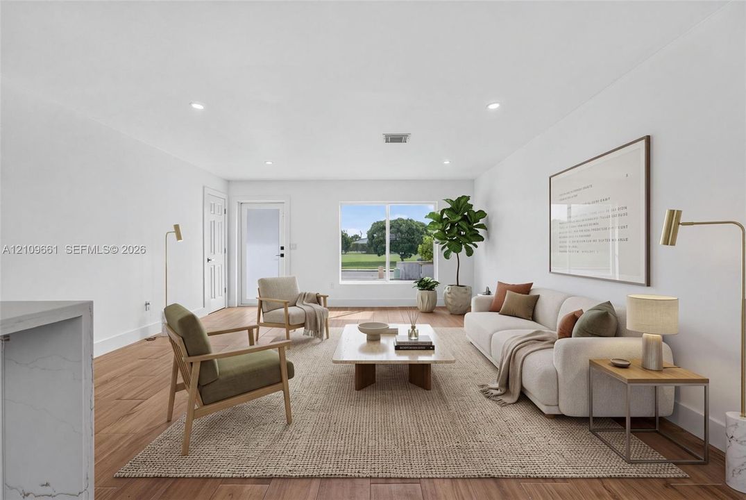 (AI-staged) Living space featuring wood-finish flooring, recessed lighting, and a large picture window