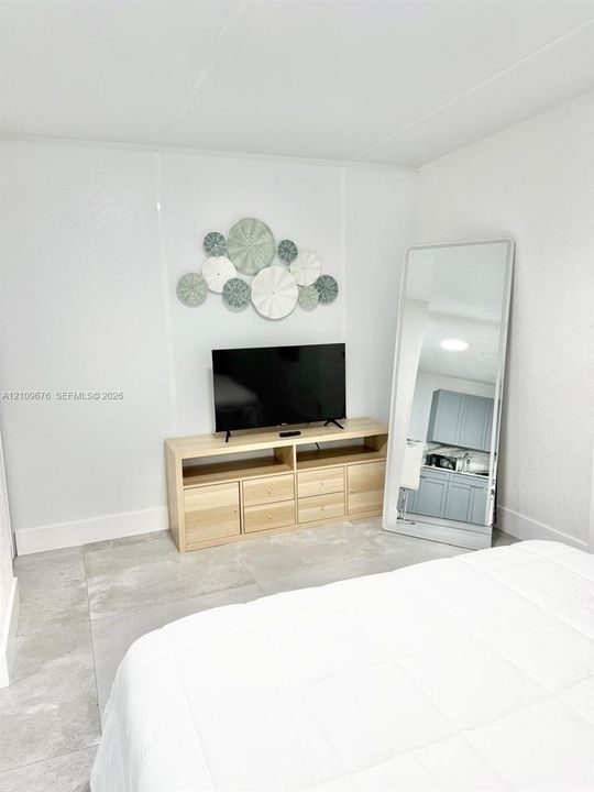 Large-format tile flooring throughout