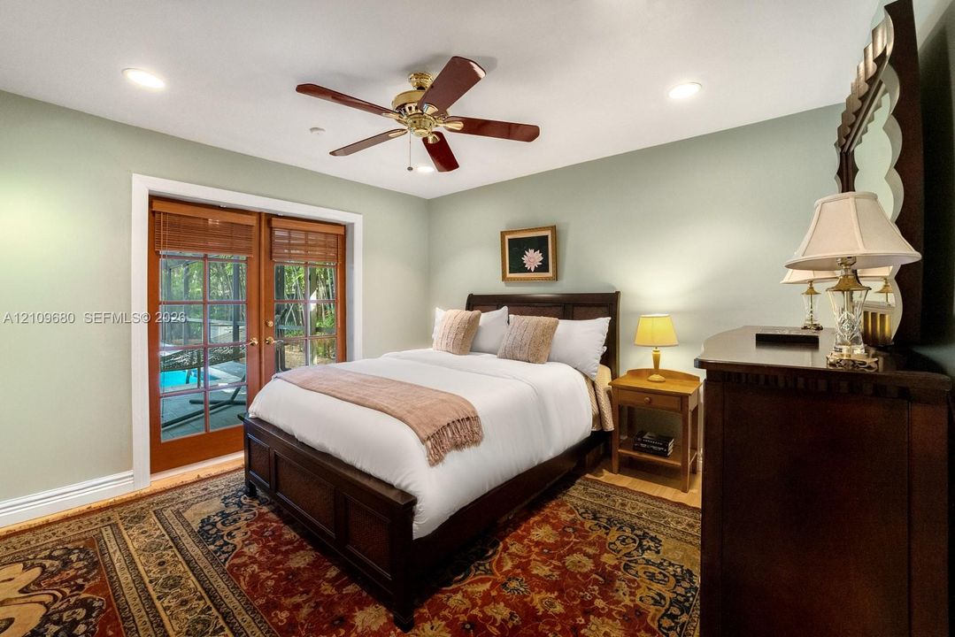 Room featuring recessed lighting, a ceiling fan, and French doors with glass panes