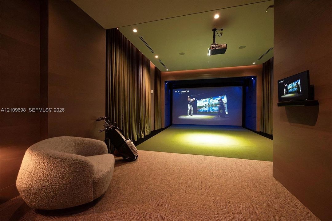 Media room featuring a built-in projector system, large projection screen, wall-to-wall carpeting, recessed ceiling lighting, and floor-to-ceiling drapery