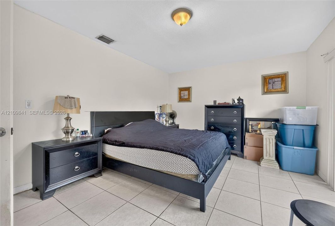 Neutral interior featuring tile flooring and a flush-mount ceiling light fixture