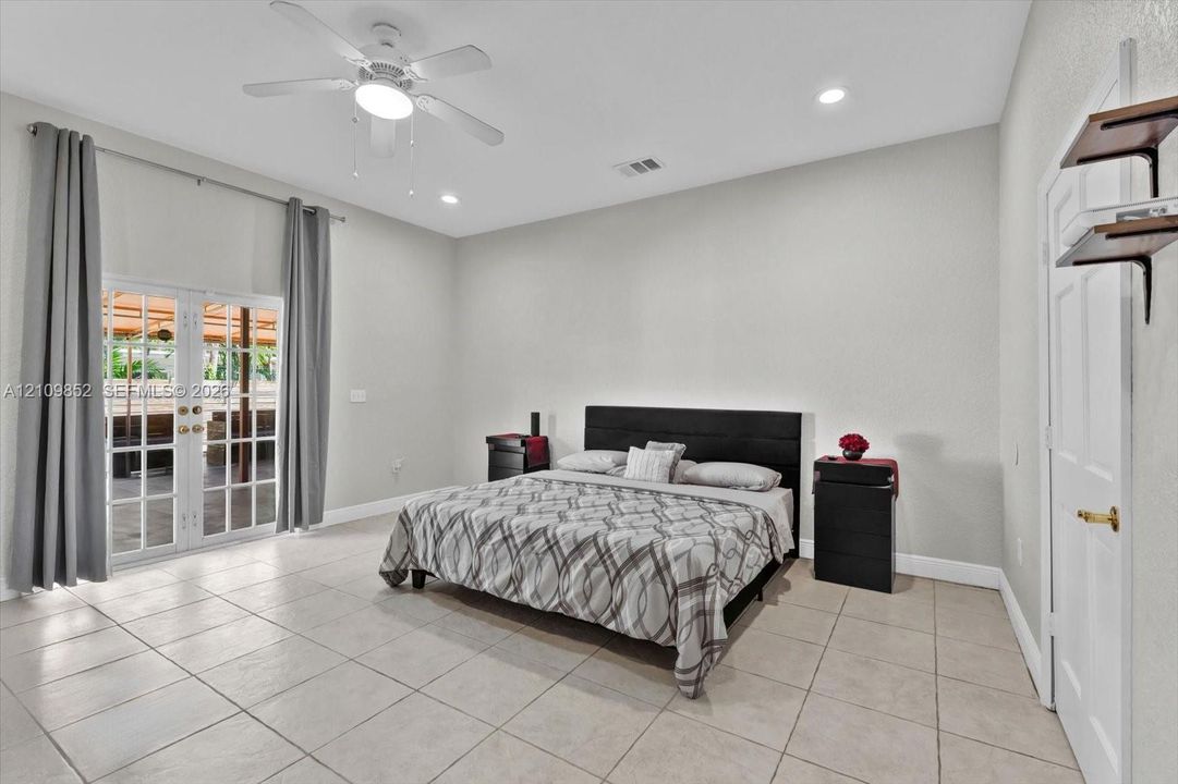 Main bedroom with  double French doors leading to the covered patio *