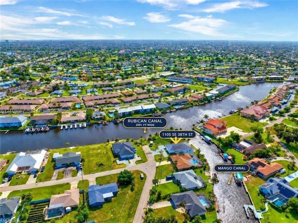 Aerial perspective featuring a waterfront property situated at the confluence of the Rubican Canal and Mango Canal